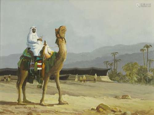 Arab on a camel before a landscape, oil on canvas, signed Ge...