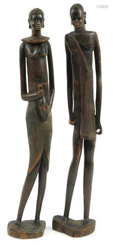 Pair of West African carved wood figures of a male and femal...