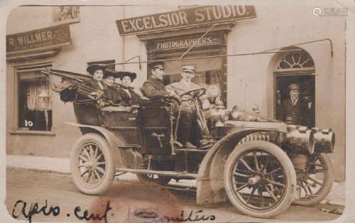 WORTHING. A photographic postcard of a motor car outside Exc...