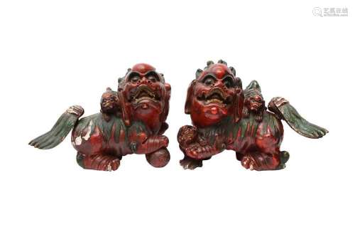 TWO CHINESE LACQUER FIGURES OF LION DOGS