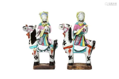 A MATCHED PAIR OF CHINESE FAMILLE-ROSE `LADY AND HORSE` FIGU...