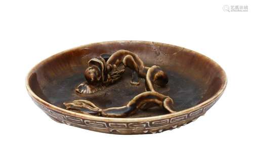 A CHINESE BROWN-GLAZED MOULDED `CHILONG` DISH