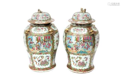 A PAIR OF CHINESE CANTON FAMILLE-ROSE BALUSTER VASES AND COV...