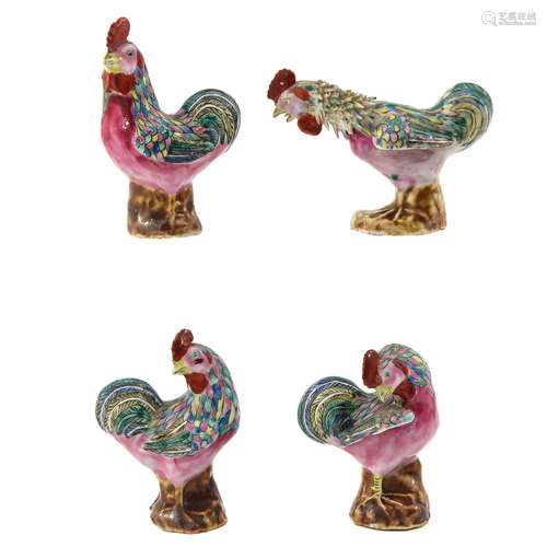 A Collection of Rooster Sculptures