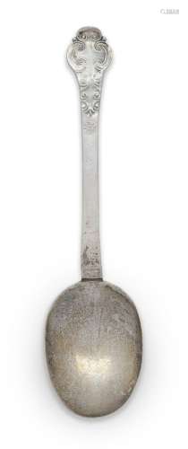 A lace-back silver trefid spoon, unmarked, the reverse of bo...