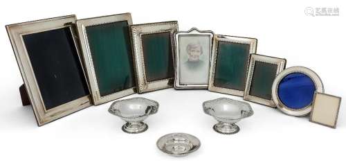 A group of eight silver mounted photo frames, various shapes...