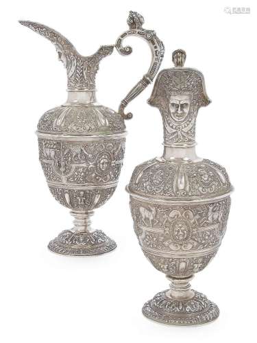 A pair of Victorian silver 'Cellini' style ewers by Robert G...