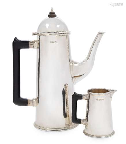 A silver coffee pot and milk jug by Theo Fennell, London, 19...