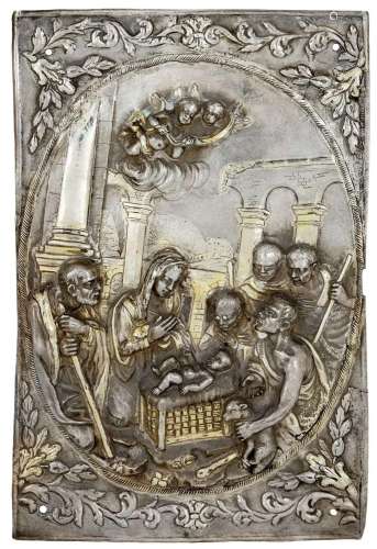 A repousse white metal plaque depicting the Adoration of the...