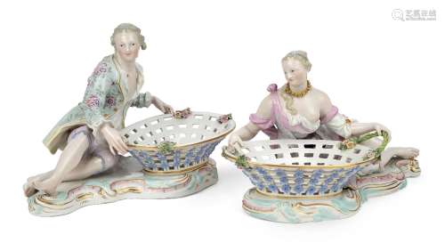 A pair of Meissen porcelain figural sweetmeat baskets