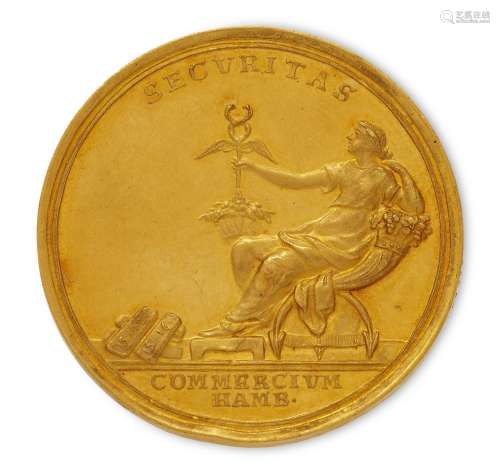 A commemorative gold medallion