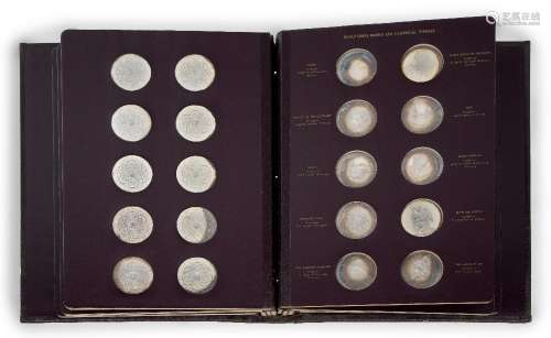 A presentation bound edition of sixty mounted silver coins