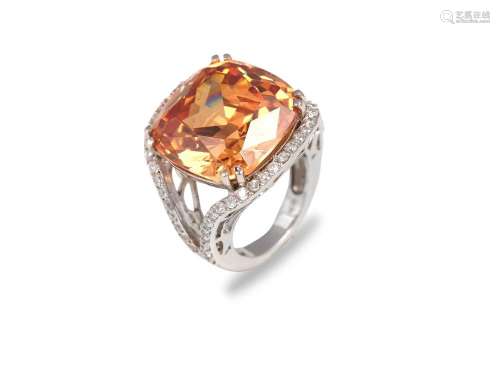 Cocktail ring, Precious metal, Orange gemstone surrounded by...