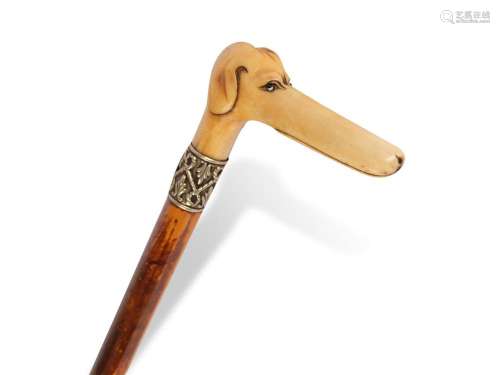 Walking stick with handle in the shape of a dog's head, ...