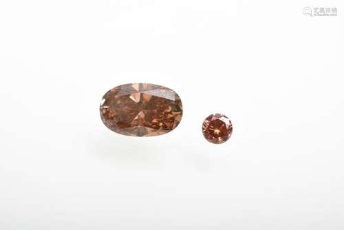 2 Ungefasste Diamanten: 1x ovaler (ca. 0.80ct/VSI/brown-oran...