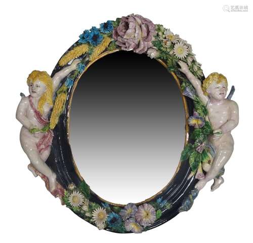 A Continental majolica style mirror, early 20th century, wit...