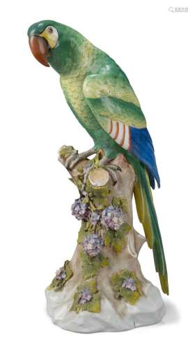 A Continental porcelain parrot, late 19th century, perched o...