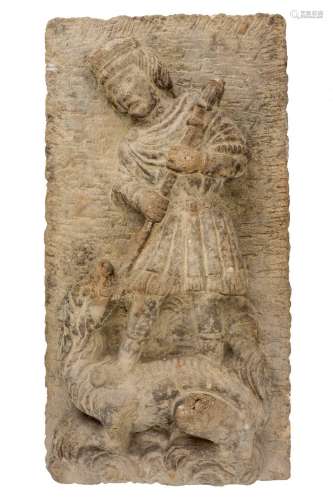 A Southern European stone relief of St George slaying the Dr...