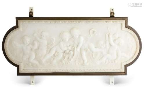 A marble relief plaque, c.1900, carved with playful putti wi...