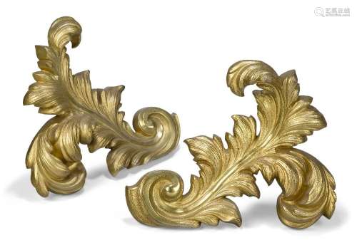 A pair of French gilt-bronze chenets, early 20th century, ea...
