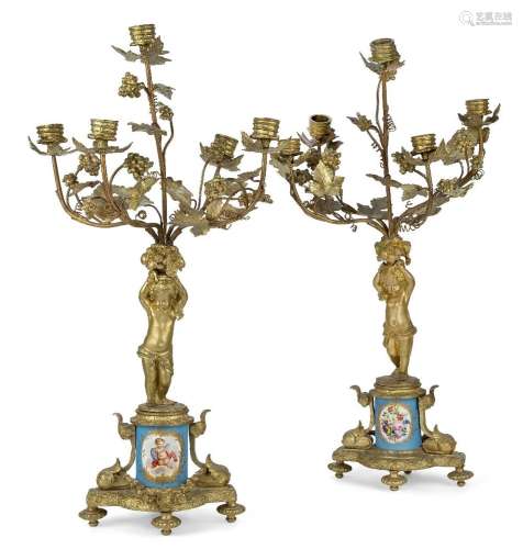 A pair of French Sevres style gilt-bronze and porcelain five...
