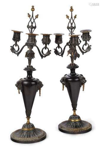 A pair of French bronze and black marble three-light candela...