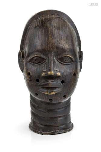 An Ife bronze head, Nigeria, with linear scarification to fa...