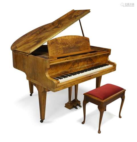 A Challen walnut baby grand piano, 20th century, raised on s...
