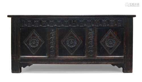 An oak coffer, 17th century, of paneled construction, the th...
