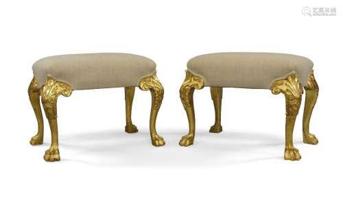 A pair of George II style giltwood stools, 20th century, wit...
