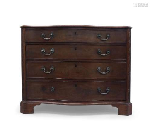 A George III mahogany serpentine front dressing chest, the t...
