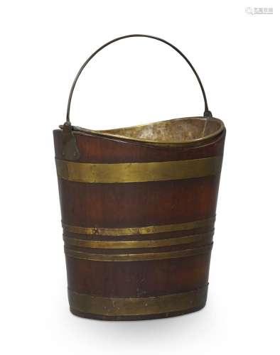 A George III brass bound mahogany peat bucket, navette form,...