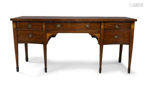 A George III mahogany serpentine front sideboard, the crossb...