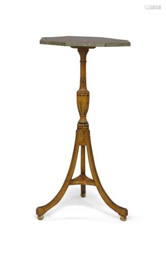 A Regency octagonal tripod table, the top laid with paper, r...