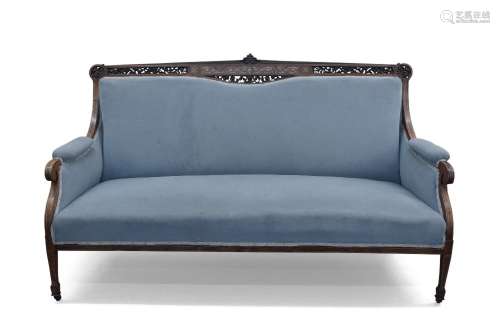 A Victorian rosewood salon sofa, the carved and pierced back...