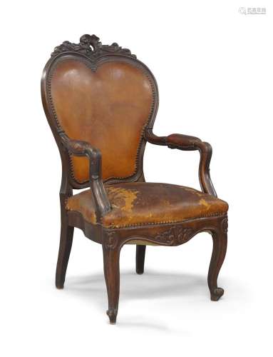 A French mahogany fauteuil, 19th century, with stud bound le...