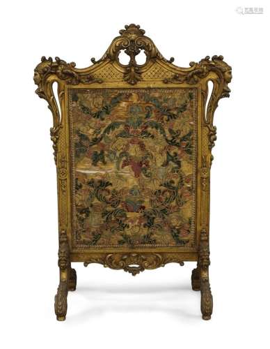 A large French giltwood fire screen, 19th century, with cent...