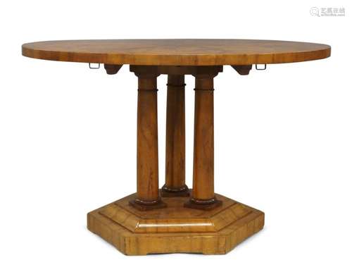 A Biedermeier walnut circular tilt top breakfast table, 19th...