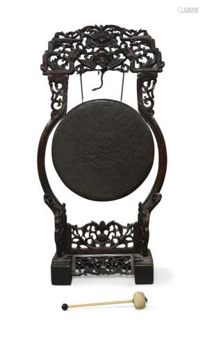 A Chinese hardwood gong, 19th century, the carved and pierce...