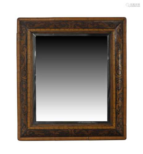 A William and Mary walnut cushion frame mirror, marquetry in...