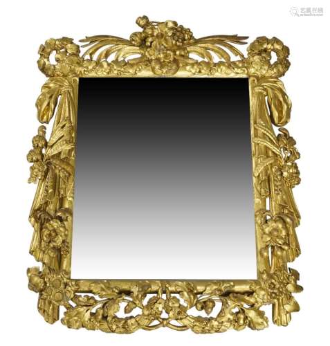 A carved giltwood mirror, 18th century, the crest carved wit...