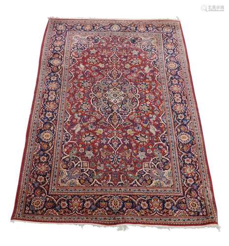 A Persian Kashan rug, late 20th century, central floral meda...