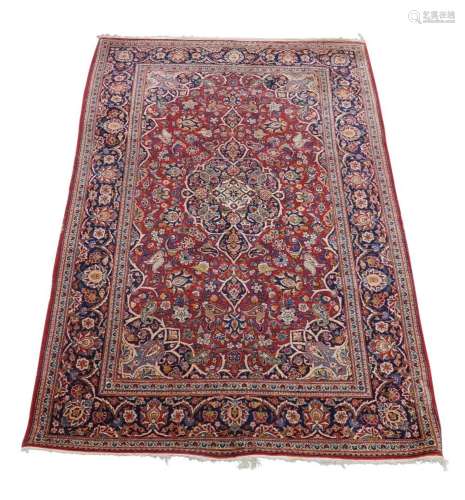 A Persian Kashan rug, late 20th century, central floral meda...