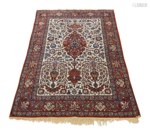 A central Persian Isfahan rug, 20th century, with central fl...