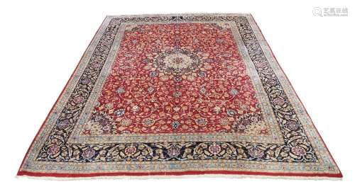 A Persian Tabriz carpet, late 20th century, central floral m...