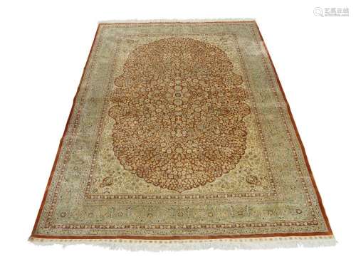 A Persian silk Qum carpet, 20th century, signed to border, t...