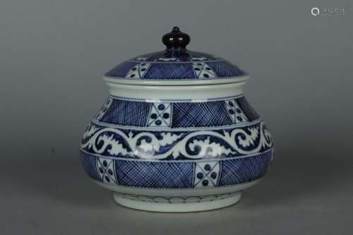 Blue and white white curly grass slanted mesh lid jar.