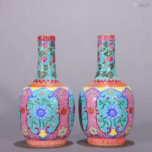 A pair of pastel flower pattern ornamental bottles