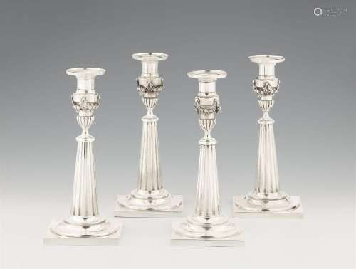 Four Augsburg silver candlesticks