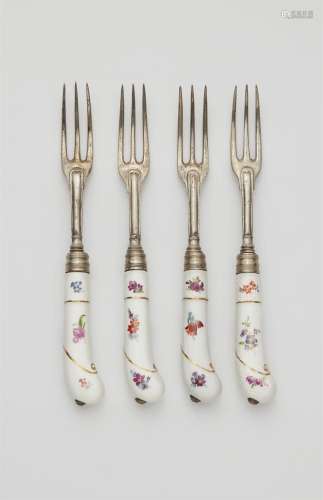 Four Augsburg silver forks with porcelain handles